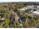 Aerial view of a wooded residential area with the Atlanta skyline in the distance at 2384 Defoors Ferry Nw Rd, Atlanta, GA 30318