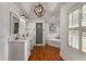 This bathroom has hardwood floors, and sinks, and a jacuzzi tub at 2384 Defoors Ferry Nw Rd, Atlanta, GA 30318