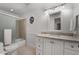 A standard bathroom with toilet, tub shower, and single vanity at 2384 Defoors Ferry Nw Rd, Atlanta, GA 30318