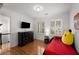 Charming bedroom with hardwood flooring, white shuttered windows, and dark wood dresser at 2384 Defoors Ferry Nw Rd, Atlanta, GA 30318