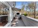 Relaxing deck area with awning, stylish outdoor chairs, and flower boxes on the railing at 2384 Defoors Ferry Nw Rd, Atlanta, GA 30318