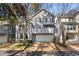 Charming two-story home with a balcony, garage, and landscaped yard at 2384 Defoors Ferry Nw Rd, Atlanta, GA 30318