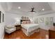 This bedroom has hardwood floors, recessed lights, and a ceiling fan at 2384 Defoors Ferry Nw Rd, Atlanta, GA 30318