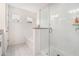 Bright bathroom with separate shower and tub featuring tiled walls at 855 Venture Sw Way, Atlanta, GA 30331