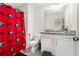 Bathroom with granite countertop and a Georgia Bulldogs themed shower curtain at 855 Venture Sw Way, Atlanta, GA 30331