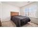 Cozy bedroom with large window and neutral carpet at 855 Venture Sw Way, Atlanta, GA 30331