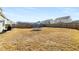 Expansive backyard with a trampoline, perfect for outdoor activities and Gathering fun at 1333 Maston Rd, Auburn, GA 30011