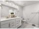 Bathroom featuring double sinks, large mirror, and ample storage at 1333 Maston Rd, Auburn, GA 30011