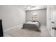 Cozy carpeted bedroom with natural light from a large window at 1333 Maston Rd, Auburn, GA 30011