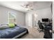 Bright bedroom featuring a bed, desk, and en suite bathroom at 1333 Maston Rd, Auburn, GA 30011