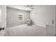 Bright, carpeted bedroom with a window and neutral decor at 1333 Maston Rd, Auburn, GA 30011