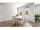 Bright dining area with a round table, white chairs, and natural light at 1333 Maston Rd, Auburn, GA 30011
