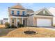 Charming two-story home featuring a brick facade and a two-car garage at 1333 Maston Rd, Auburn, GA 30011