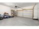 Spacious two-car garage, epoxy flooring, equipped with an automatic door opener, and ample storage space at 1333 Maston Rd, Auburn, GA 30011