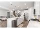 Modern kitchen with stainless steel appliances, a center island, and white cabinets at 1333 Maston Rd, Auburn, GA 30011