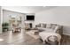 Cozy living room with a comfortable sofa, patterned chairs, and a fireplace at 1333 Maston Rd, Auburn, GA 30011