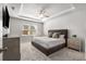 Comfortable main bedroom with tray ceiling, plush carpet, and plenty of natural light at 1333 Maston Rd, Auburn, GA 30011