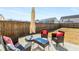 Cozy patio seating with table and umbrella, perfect for outdoor relaxation and entertainment at 1333 Maston Rd, Auburn, GA 30011
