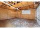 Spacious unfinished garage interior with an open ceiling and concrete floor at 3078 Heatherbrook Trce, Canton, GA 30114