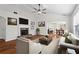 Bright living room with fireplace, hardwood floors, and lots of natural light at 3078 Heatherbrook Trce, Canton, GA 30114