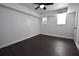 Spacious finished basement featuring a ceiling fan, two windows and clean, white walls at 232 Mathewson Sw Pl, Atlanta, GA 30314