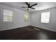 Bedroom features dark wood floors, white trim, and lots of natural light at 232 Mathewson Sw Pl, Atlanta, GA 30314