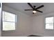 Bedroom featuring dark wood floors, a ceiling fan, and natural light at 232 Mathewson Sw Pl, Atlanta, GA 30314