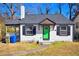 Charming home with a new gray roof, a green front door, and black trim at 232 Mathewson Sw Pl, Atlanta, GA 30314