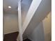 Staircase featuring white rails and dark wood floors at 232 Mathewson Sw Pl, Atlanta, GA 30314
