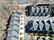 Aerial view of townhomes with mature landscaping and a street that borders the tree line at 2349 Harshaw Ave, Lawrenceville, GA 30043