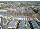 Aerial view of a residential community with tree-lined streets and well-maintained townhomes at 2349 Harshaw Ave, Lawrenceville, GA 30043