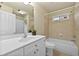 Well-lit bathroom featuring a single sink vanity and a shower-tub combination with tile surround at 2349 Harshaw Ave, Lawrenceville, GA 30043