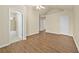 Hardwood floors, high ceilings with fan and view to en-suite bath and walk-in closet at 2349 Harshaw Ave, Lawrenceville, GA 30043
