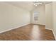 Bedroom featuring hardwood floors, high ceilings with fan and a window at 2349 Harshaw Ave, Lawrenceville, GA 30043