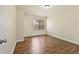 Bedroom with hardwood floors and a bright window providing natural light at 2349 Harshaw Ave, Lawrenceville, GA 30043