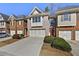 Charming townhome featuring a brick facade, a two-car garage, and a well-maintained lawn at 2349 Harshaw Ave, Lawrenceville, GA 30043