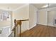 Bright foyer featuring hardwood floors, beautiful staircase and large windows filling the space with natural light at 2349 Harshaw Ave, Lawrenceville, GA 30043
