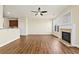 Open floor plan showing the kitchen, living room with fireplace, and beautiful hardwood floors at 2349 Harshaw Ave, Lawrenceville, GA 30043