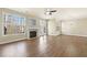 Spacious living room offers large windows, a fireplace, hardwood floors, and a ceiling fan for year-round comfort at 2349 Harshaw Ave, Lawrenceville, GA 30043