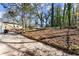 A spacious backyard with a concrete patio and a grassy area, perfect for outdoor activities at 1428 Pinehurst Sw Dr, Atlanta, GA 30311
