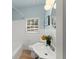 Bathroom with a shower/tub combination, updated sink, and natural light at 1428 Pinehurst Sw Dr, Atlanta, GA 30311