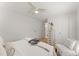Light-filled bedroom with a modern ceiling fan, light hardwood floors, and ample storage at 1428 Pinehurst Sw Dr, Atlanta, GA 30311