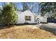 Charming home with a well-manicured lawn and a paved driveway at 1428 Pinehurst Sw Dr, Atlanta, GA 30311