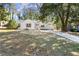 Charming home with a well-manicured lawn and a paved driveway at 1428 Pinehurst Sw Dr, Atlanta, GA 30311
