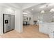 Bright kitchen with stainless steel appliances and quartz countertops flows into dining area at 1428 Pinehurst Sw Dr, Atlanta, GA 30311