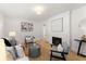 Bright living room features a fireplace, hardwood floors, and neutral decor at 1428 Pinehurst Sw Dr, Atlanta, GA 30311