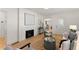 Bright living room features a fireplace, hardwood floors, and neutral decor at 1428 Pinehurst Sw Dr, Atlanta, GA 30311