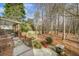Beautiful backyard featuring a patio, wooden fence, landscaping, and plenty of shade at 1558 Amberwood Creek Nw Dr, Kennesaw, GA 30152