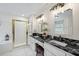 Elegant bathroom features double sinks, granite countertops, a shower with glass door and a soaking tub at 1558 Amberwood Creek Nw Dr, Kennesaw, GA 30152