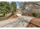Long driveway leading to a two-car garage, surrounded by mature trees at 1558 Amberwood Creek Nw Dr, Kennesaw, GA 30152